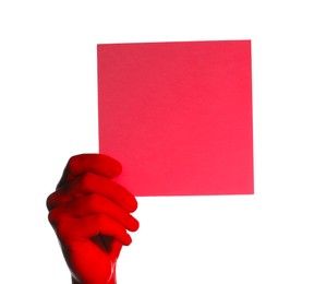 Man holding red sheet of paper on white background, closeup. Mockup for design