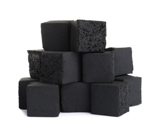 Photo of Stack of charcoal cubes for hookah on white background