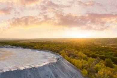 Image of Beautiful aerial view of granite cliff at sunrise