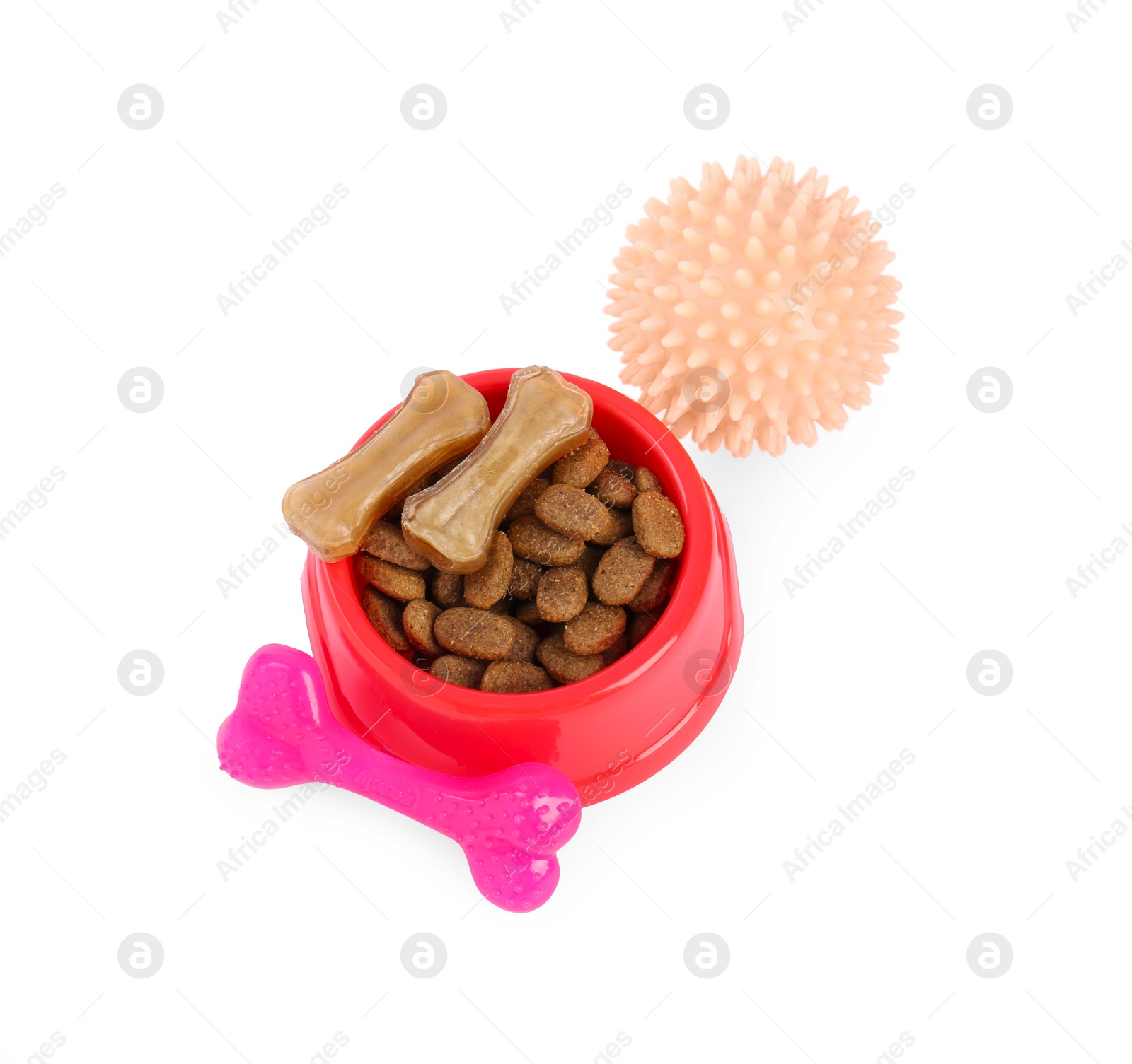 Photo of Pet dry food in bowl, treats and toys on white background. Shop assortment