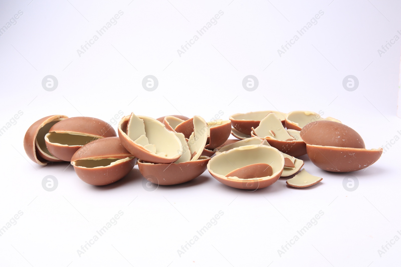 Photo of Sveti Vlas, Bulgaria - July 3, 2023: Broken halves of Kinder Surprise Eggs isolated on white