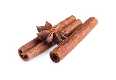 Photo of Cinnamon sticks and anise star isolated on white