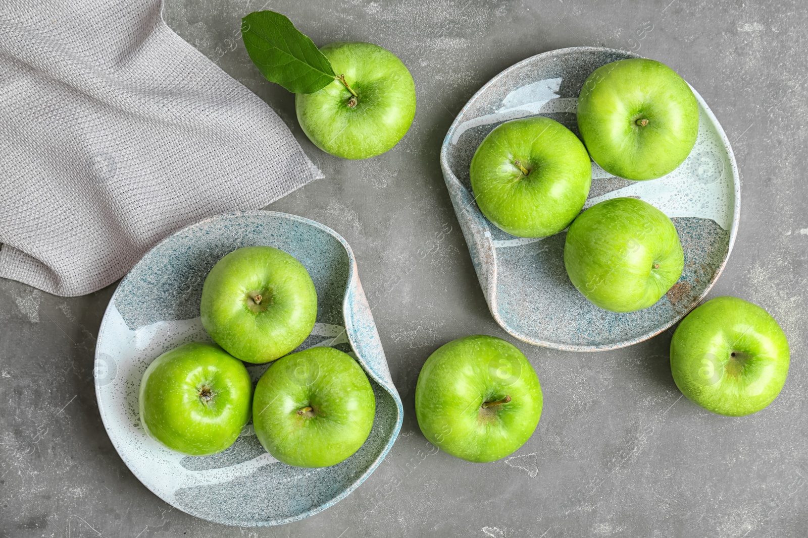 Photo of Composition with fresh green apples on grey table, top view