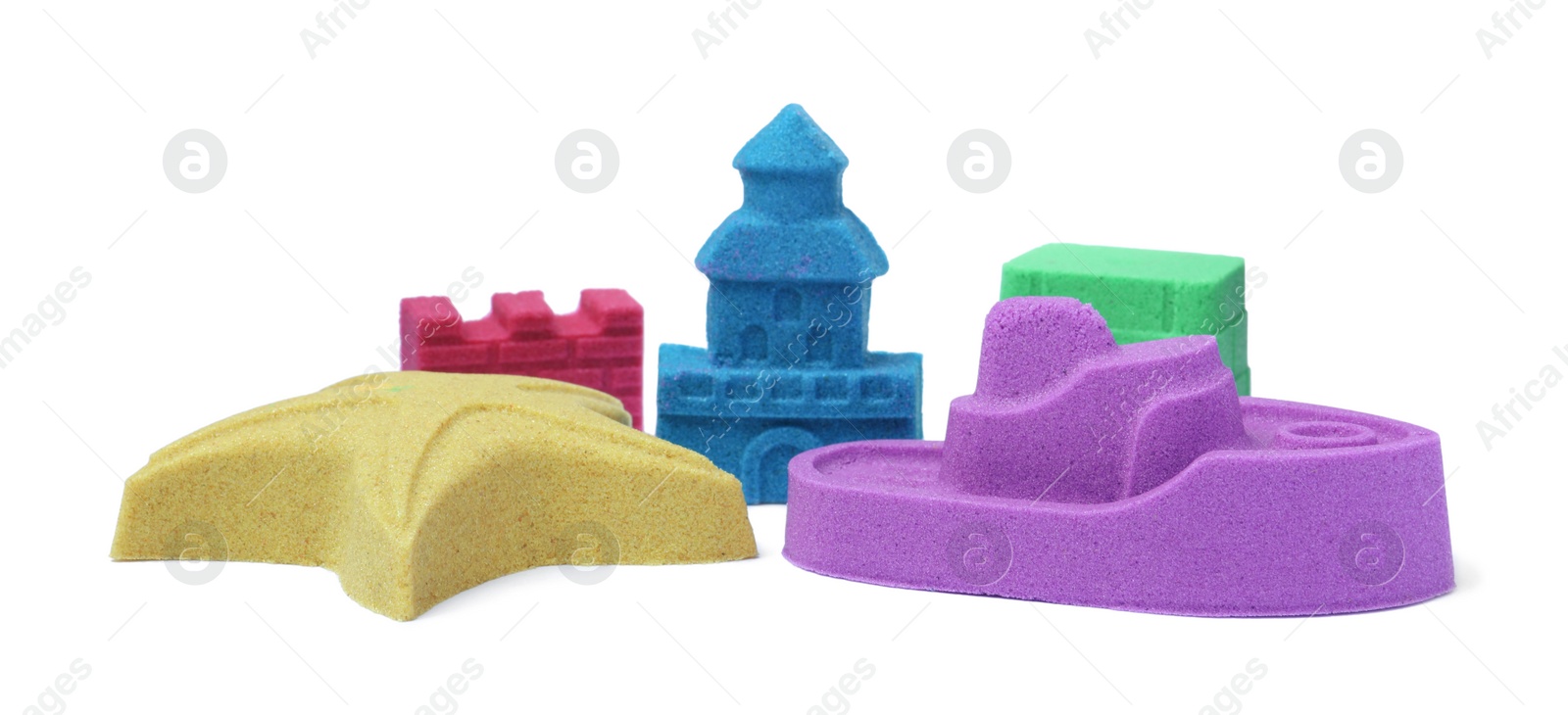 Photo of Different figures made of kinetic sand on white background