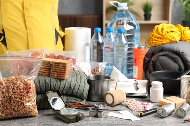 Disaster supply kit for earthquake on grey table indoors