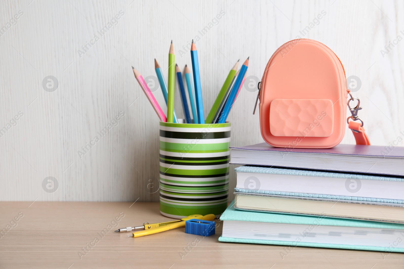 Photo of Different stationery on wooden table. Back to school