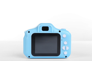 Light blue toy camera isolated on white