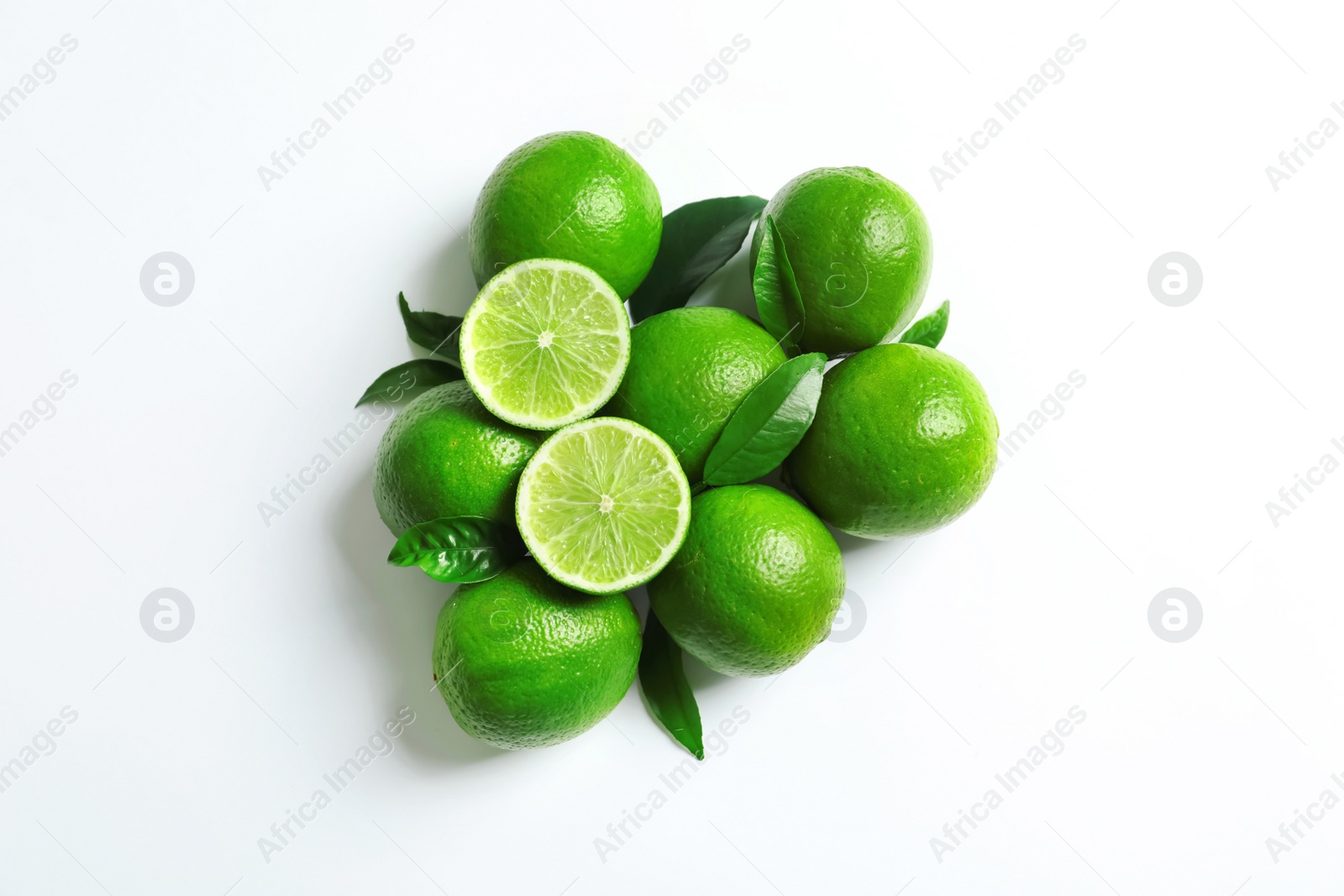 Photo of Fresh ripe limes on white background, top view