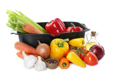 Photo of Black pot and pile of fresh products isolated on white