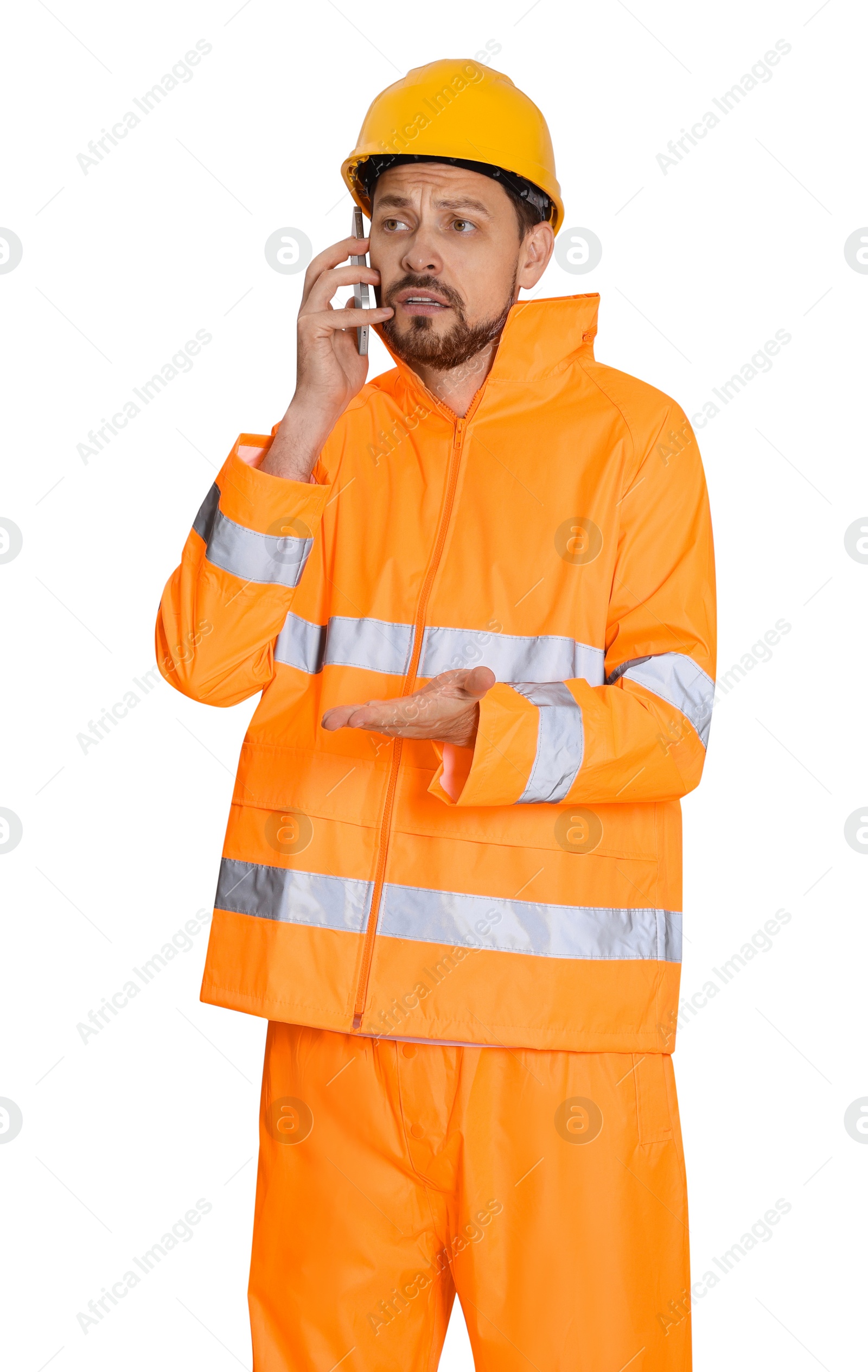 Photo of Man in reflective uniform talking on phone against white background