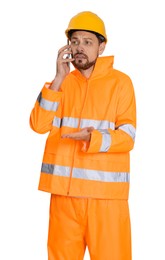 Man in reflective uniform talking on phone against white background