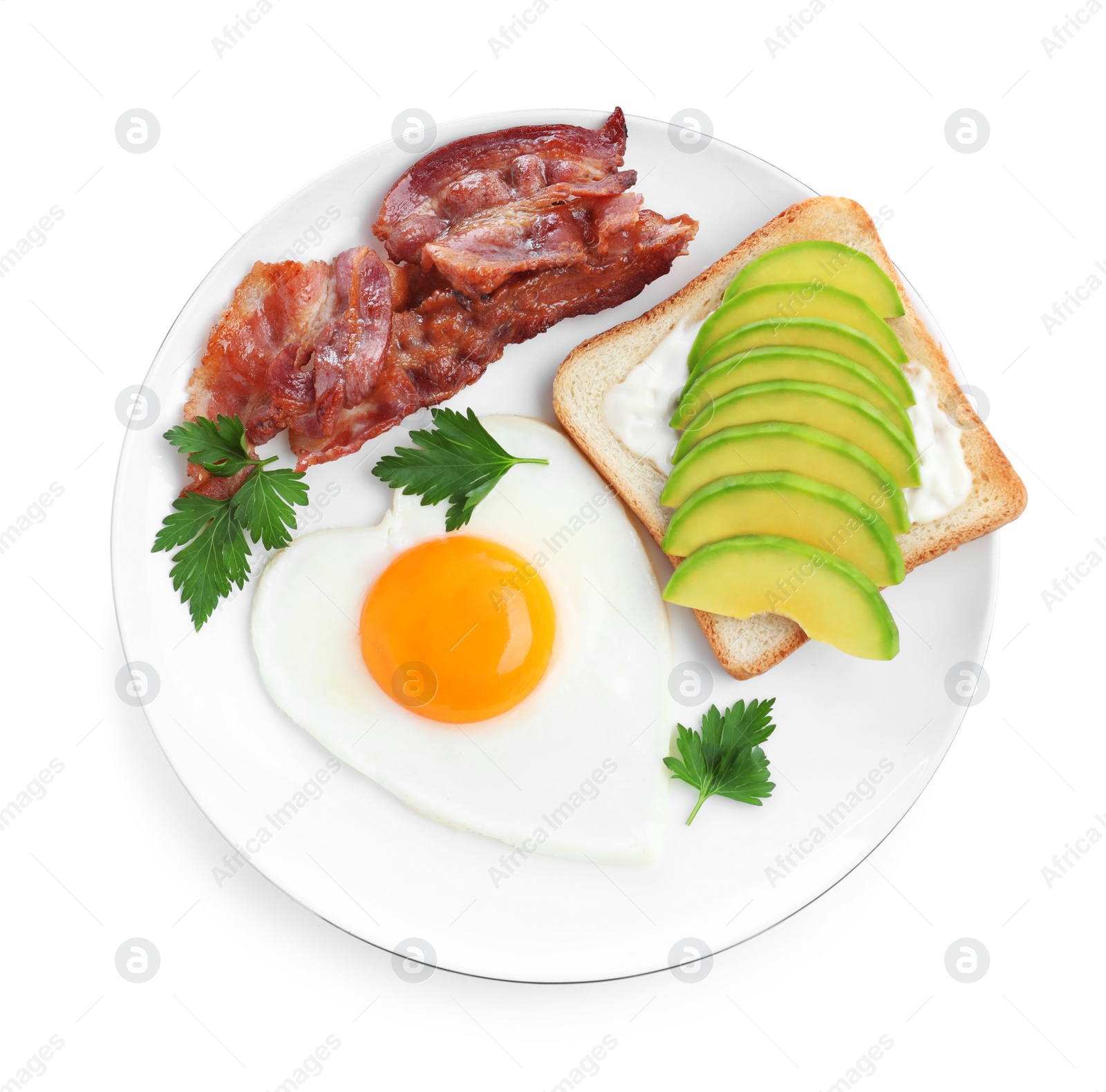 Photo of Romantic breakfast with fried bacon, heart shaped egg and avocado toast isolated on white, top view. Valentine's day celebration