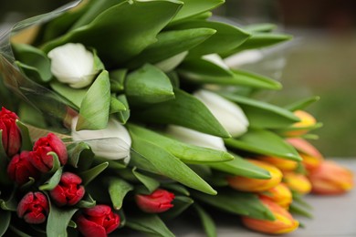 Photo of Beautiful bouquets of colorful tulips outdoors, closeup