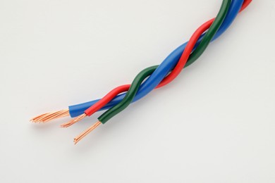 Colorful electrical wires on white background, closeup