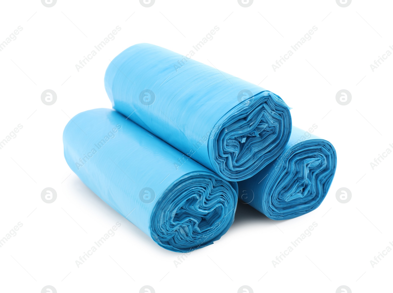 Photo of Rolls of light blue garbage bags isolated on white