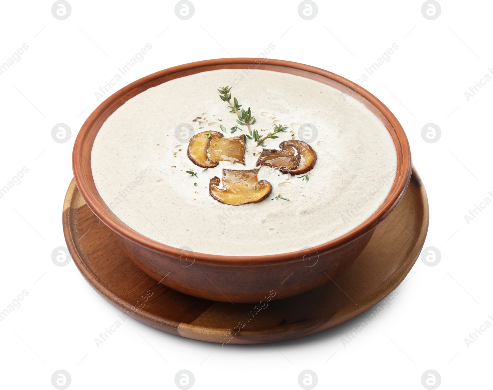 Photo of Fresh homemade mushroom soup in ceramic bowl isolated on white