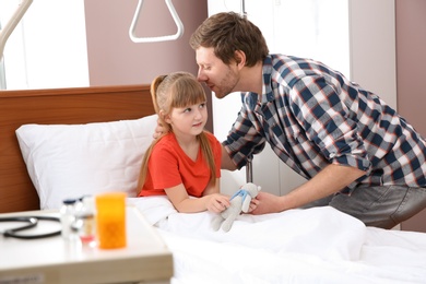 Photo of Man visiting his little child in hospital