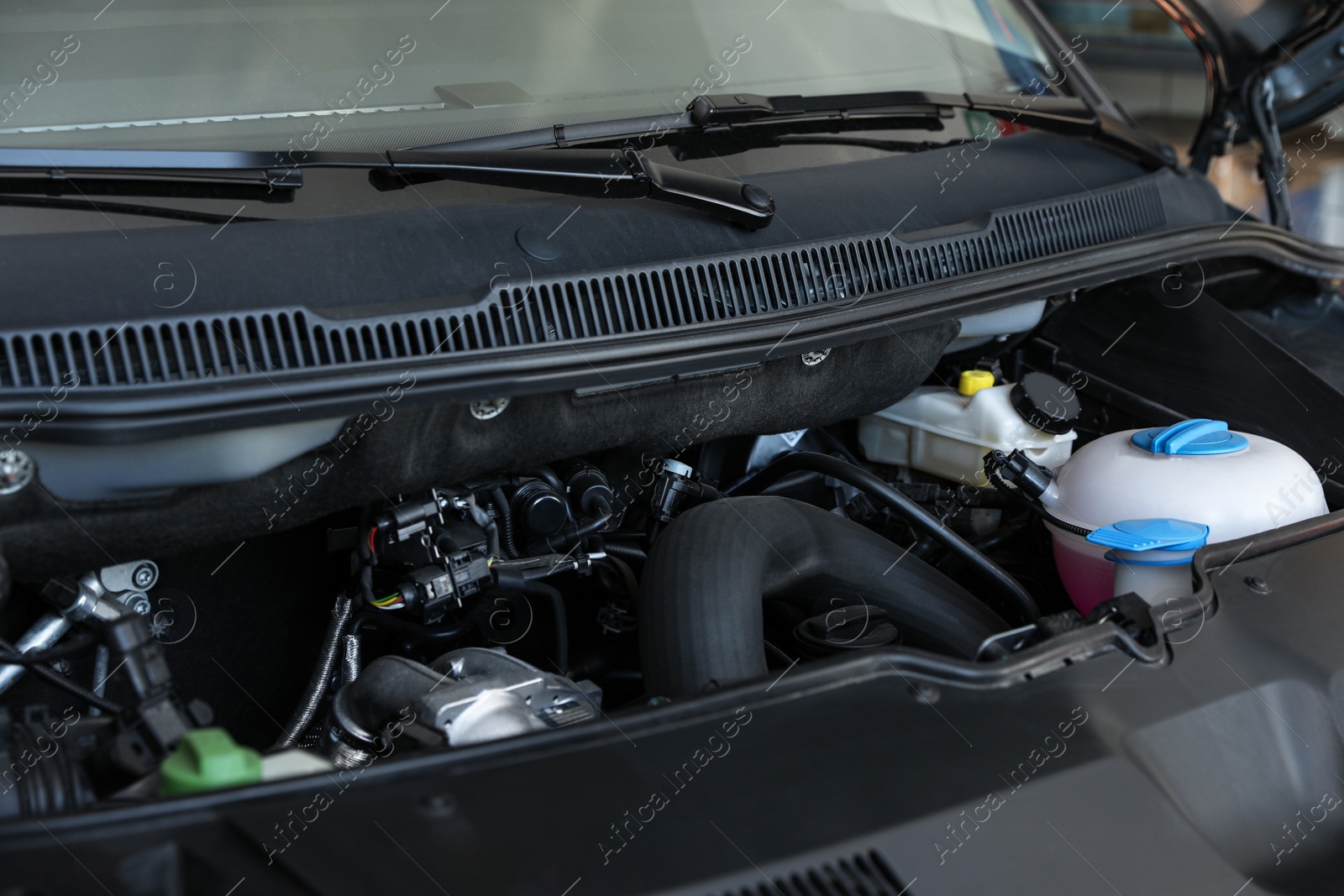 Photo of Closeup view of engine bay in modern auto