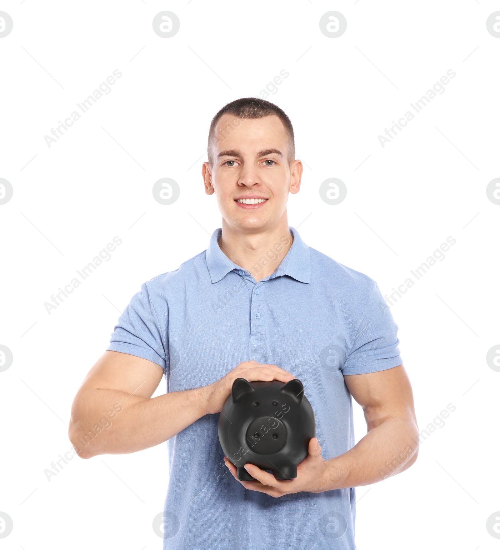 Photo of Young man with piggy bank on white background