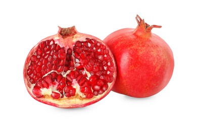 Half and whole pomegranates isolated on white