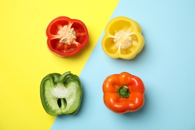 Flat lay composition with raw ripe paprika peppers on color background