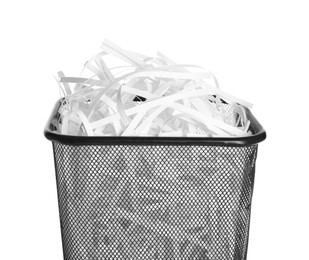 Photo of Trash bin with shredded paper strips isolated on white