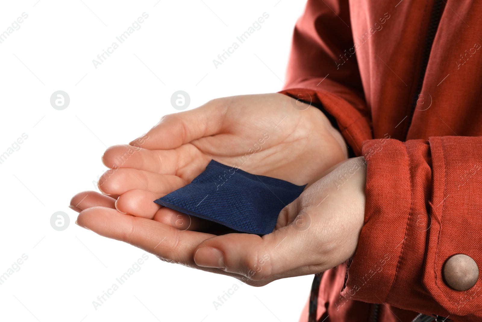 Photo of Woman holding hand warmer on white background, closeup