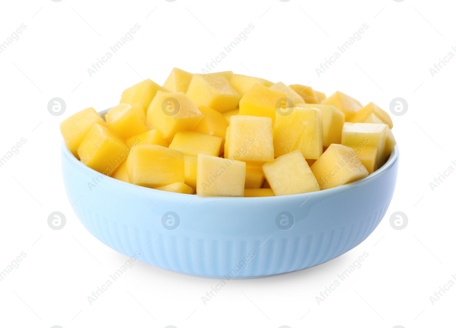 Photo of Tasty mango cubes in ceramic bowl isolated on white