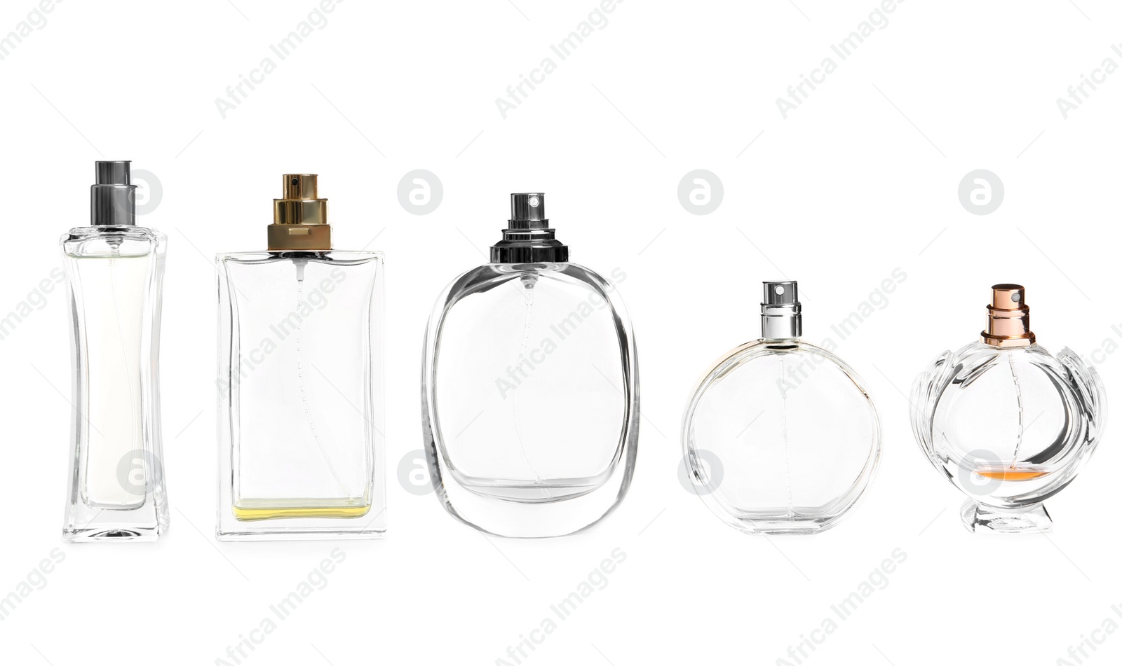 Photo of Different perfume bottles on white background