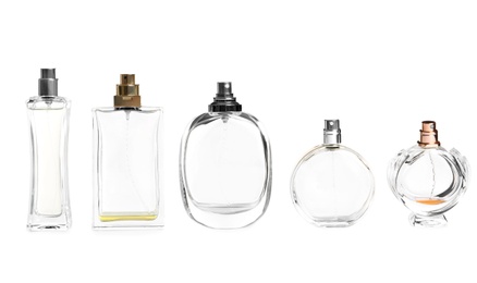 Photo of Different perfume bottles on white background