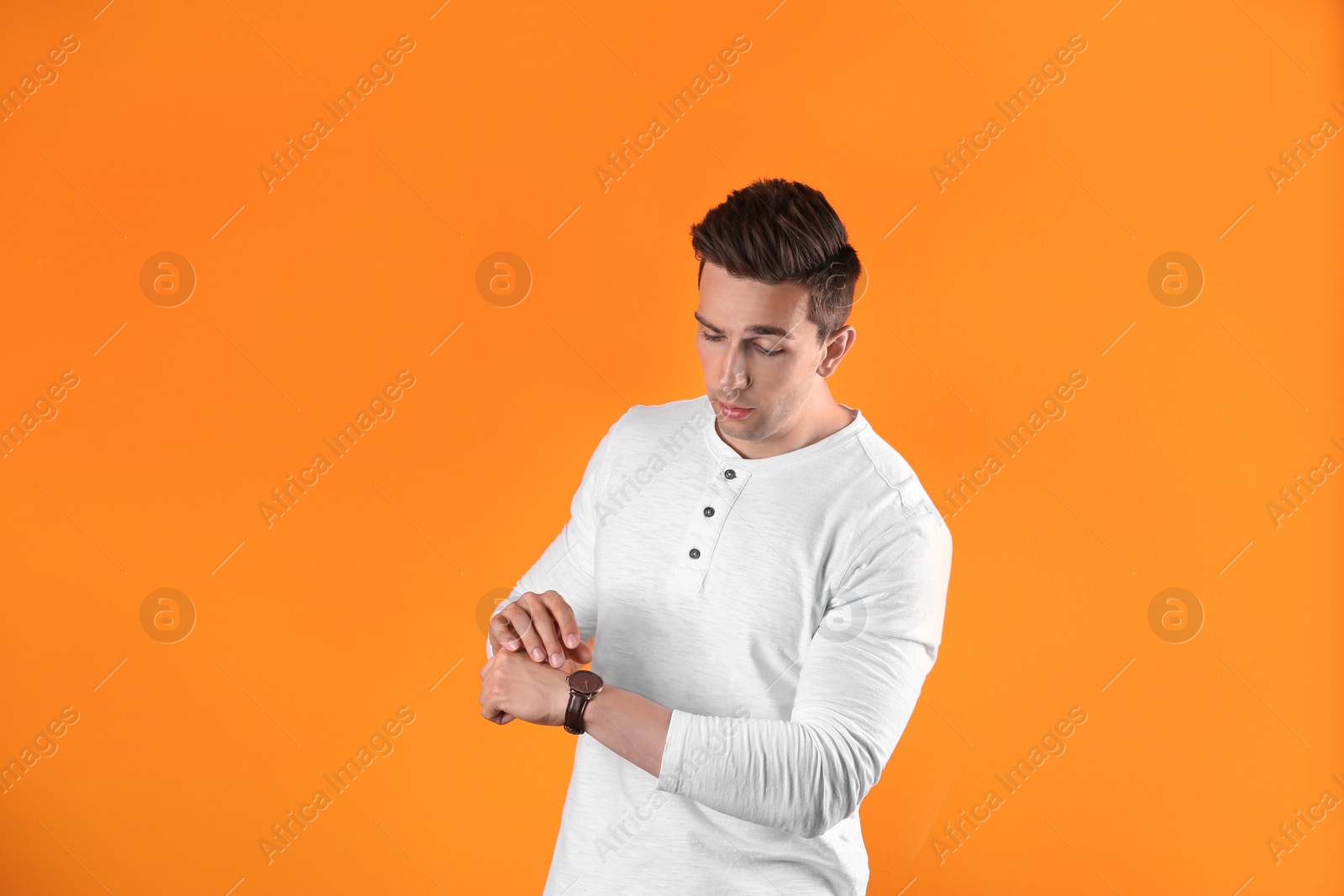 Photo of Handsome young man on color background