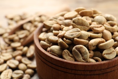 Photo of Green coffee beans on table, closeup. Space for text