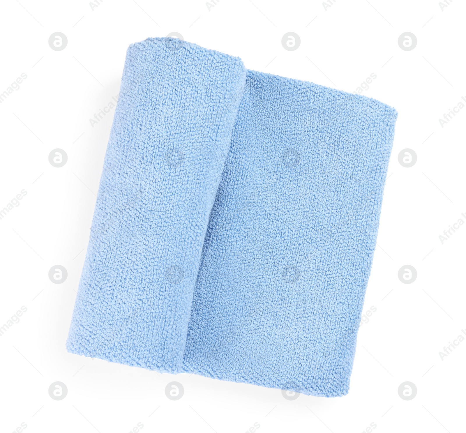 Photo of Light blue soft terry towel isolated on white, top view