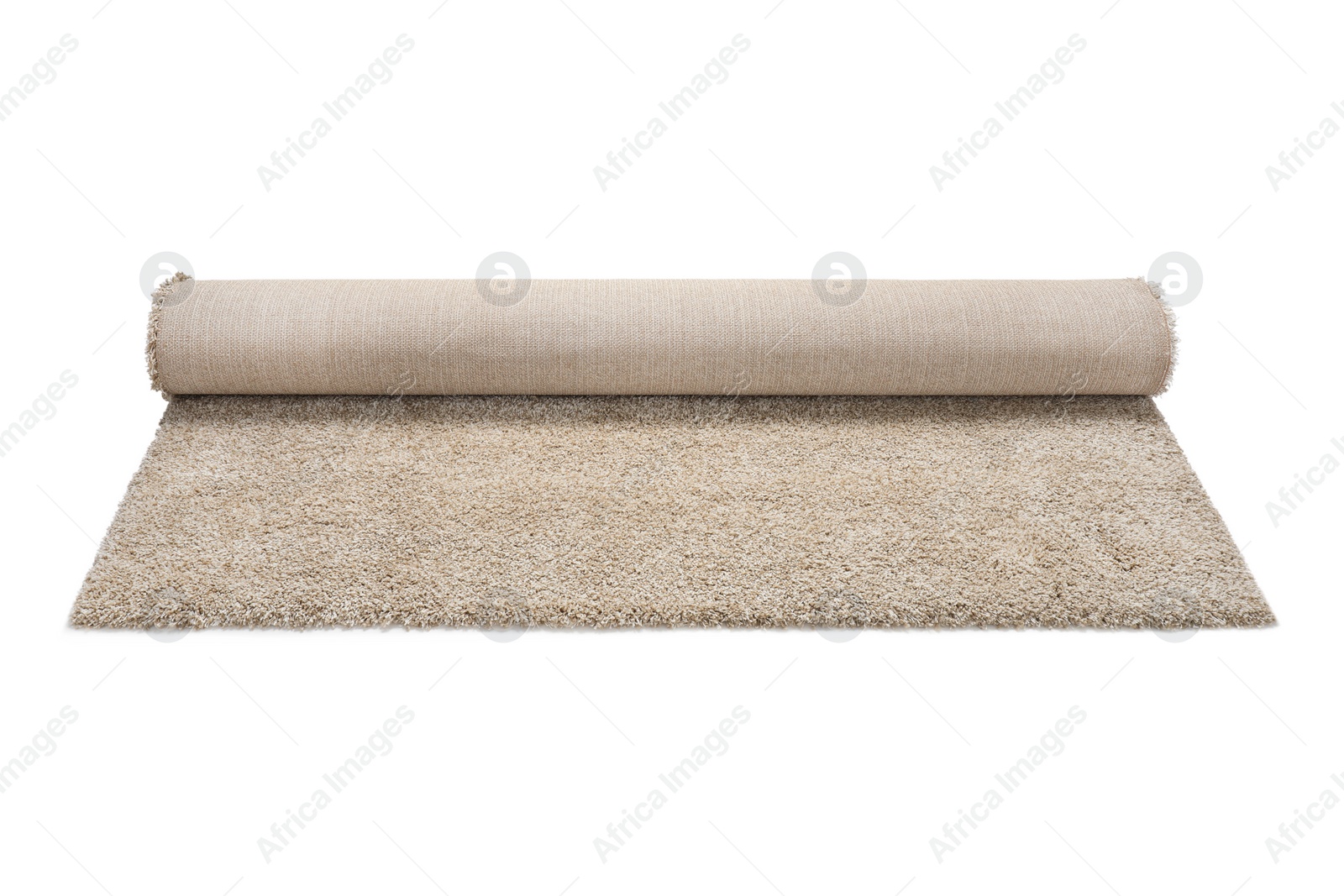 Photo of Rolled fuzzy carpet on white background. Interior element