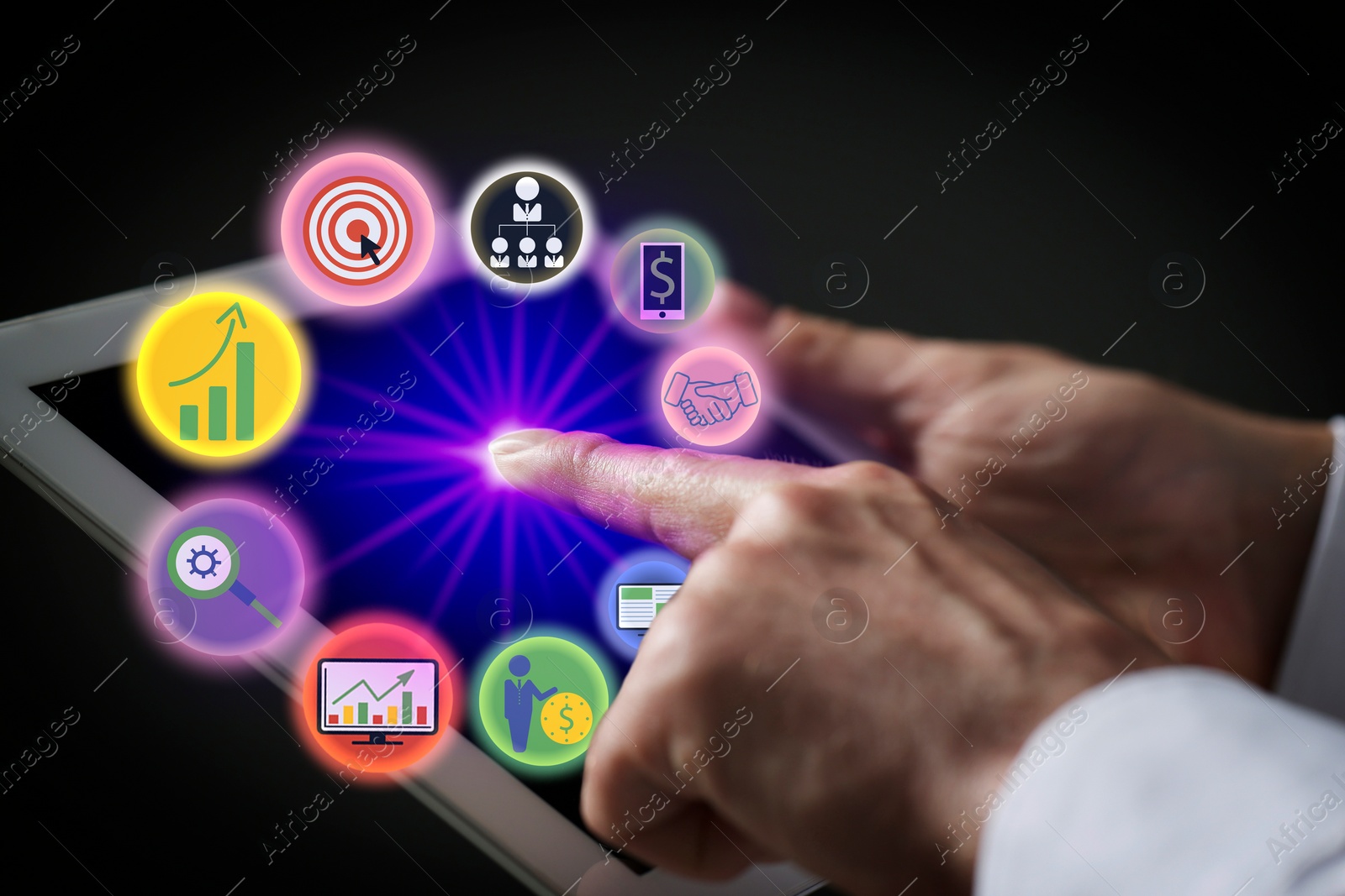 Image of Marketing. Man using tablet against black background, closeup. Virtual icons popping out from device screen