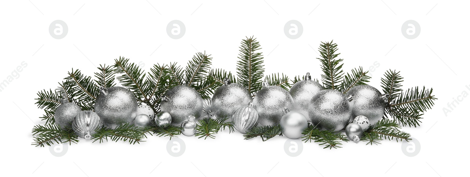 Photo of Many silver Christmas balls and fir twigs isolated on white