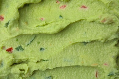 Photo of Delicious guacamole sauce as background, top view