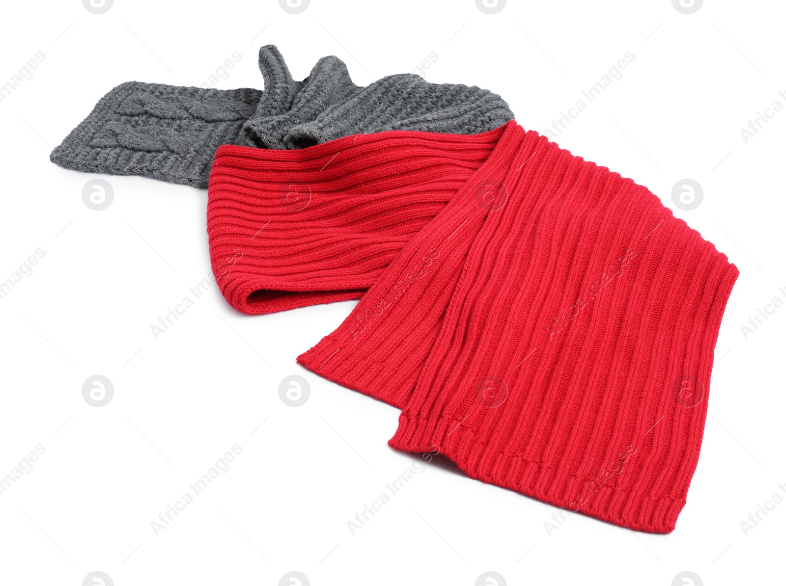 Photo of Two soft knitted scarfs on white background