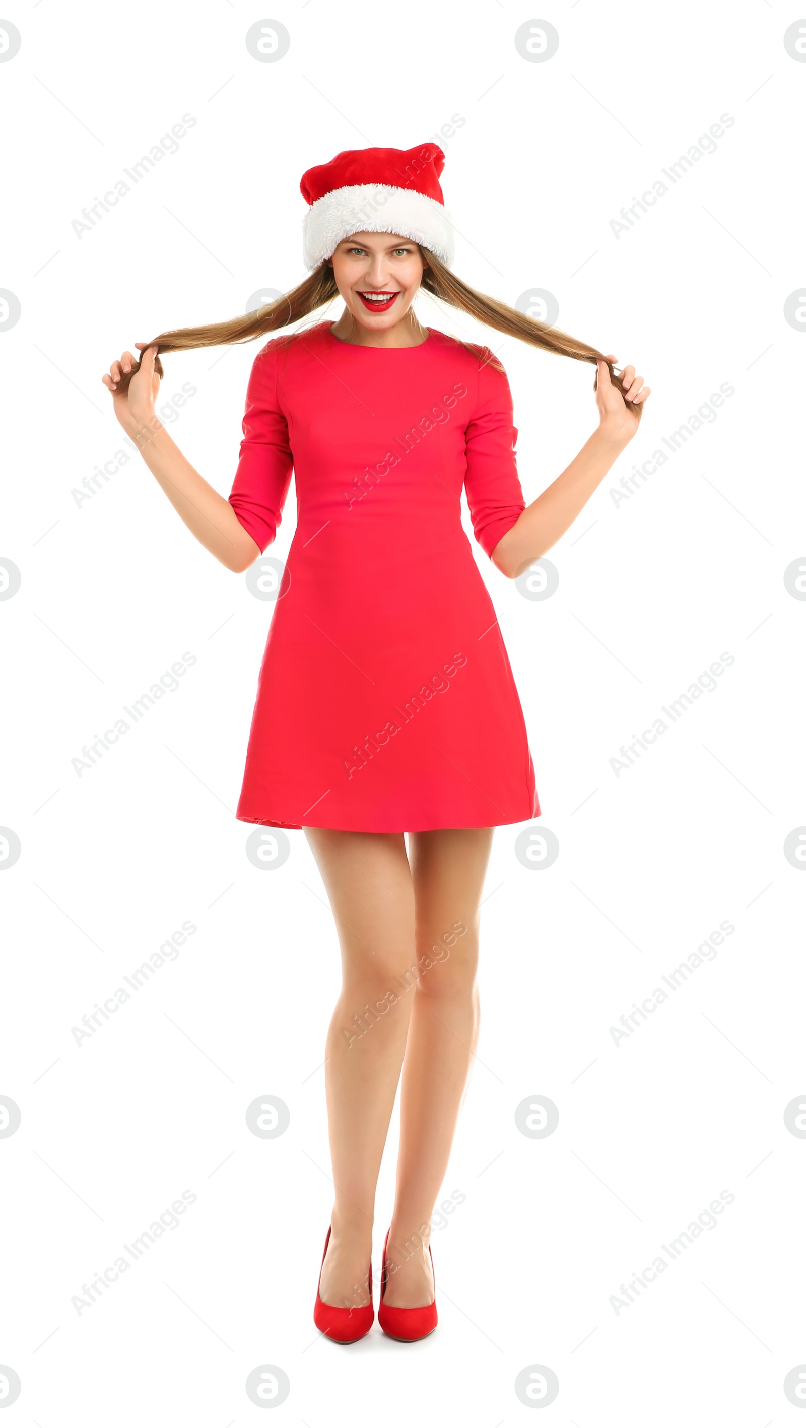 Photo of Young beautiful woman in Santa hat on white background. Christmas celebration