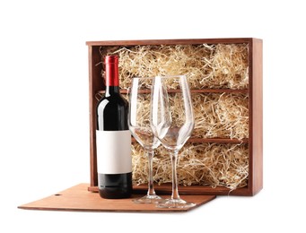 Photo of Wooden gift box, wine and glasses isolated on white