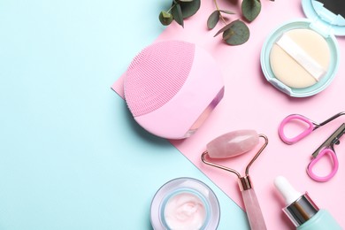 Flat lay composition with different skin care and makeup products on color background, space for text