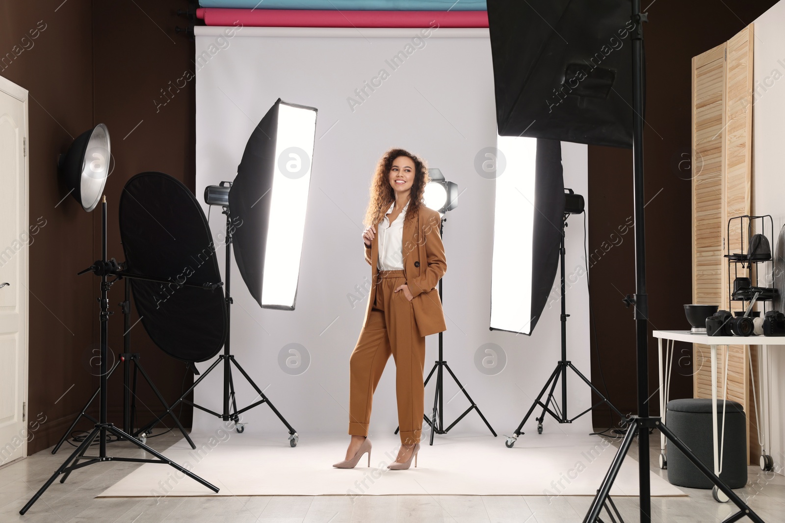 Photo of Beautiful African American model posing in studio. Professional photo session