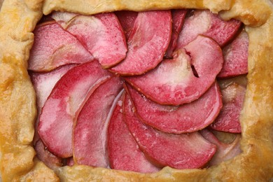 Photo of Delicious galette with apples as background, top view