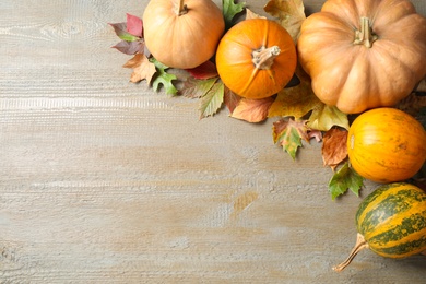 Autumn vegetables on wooden background, flat lay with space for text. Happy Thanksgiving day