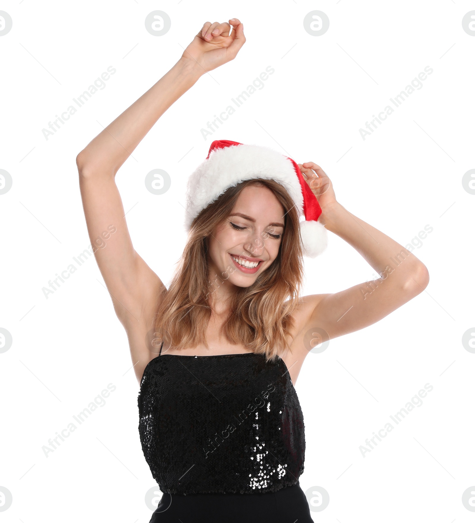 Photo of Happy young woman in Santa hat on white background. Christmas celebration