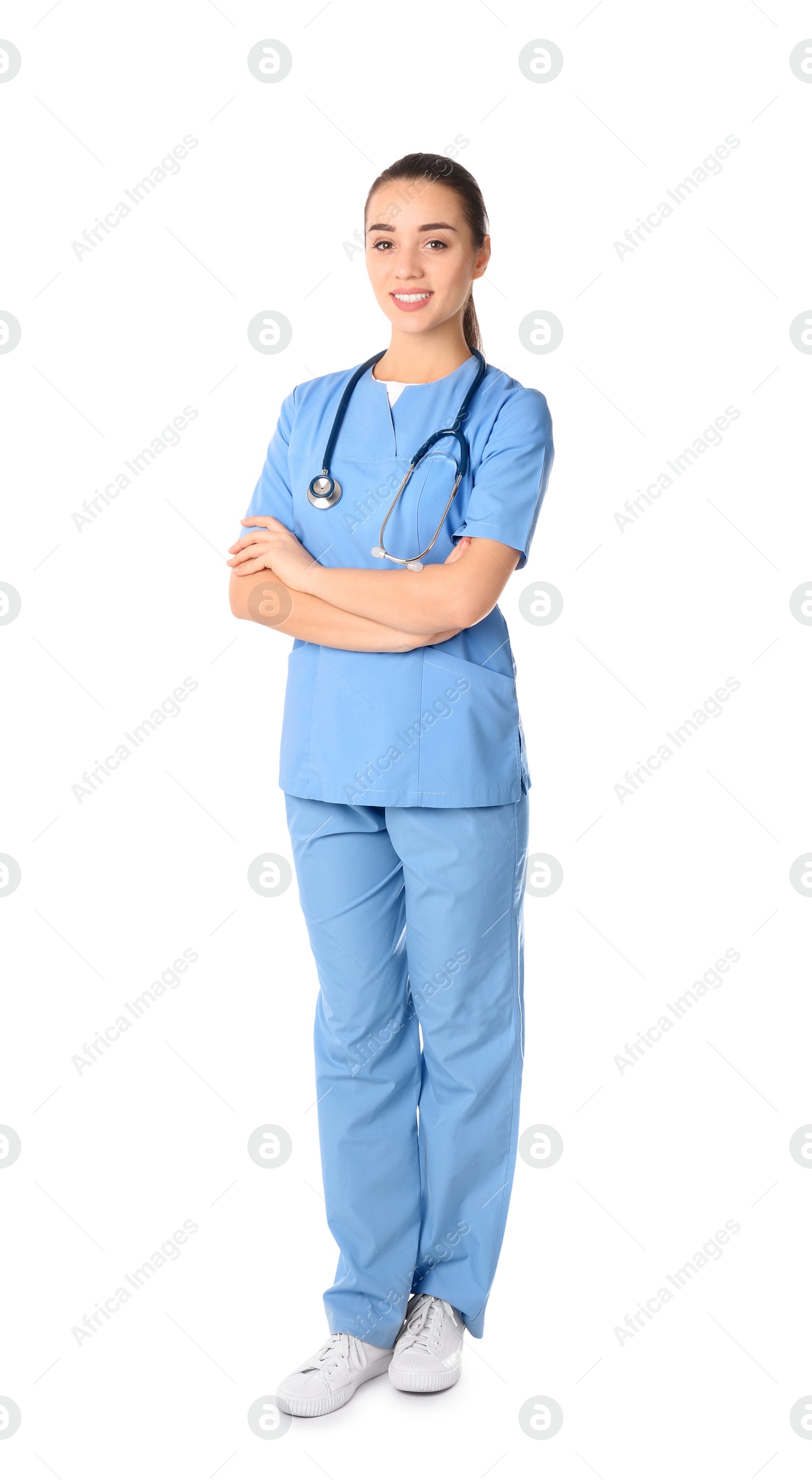 Photo of Young medical student in uniform on white background