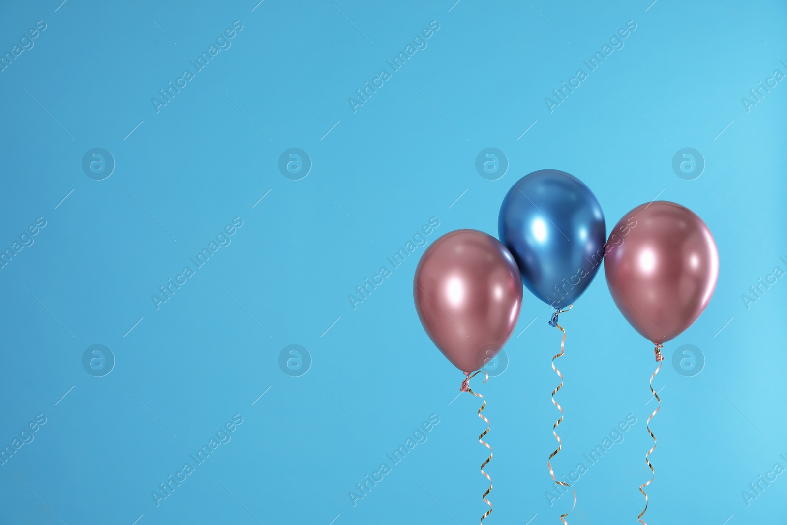 Photo of Bright balloons on color background. Space for text