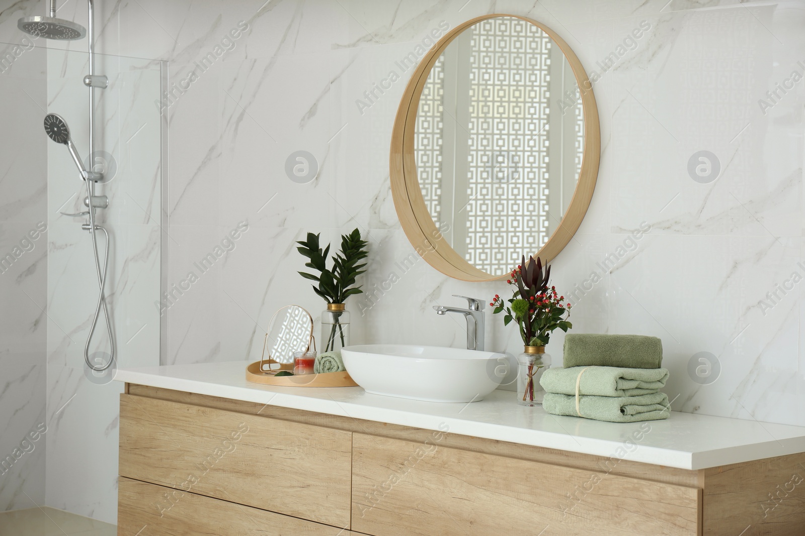 Photo of Modern bathroom interior with stylish mirror and vessel sink