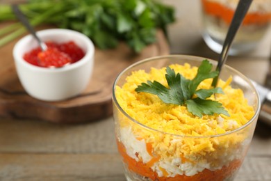 Photo of Traditional russian salad Mimosa served on table, closeup. Space for text