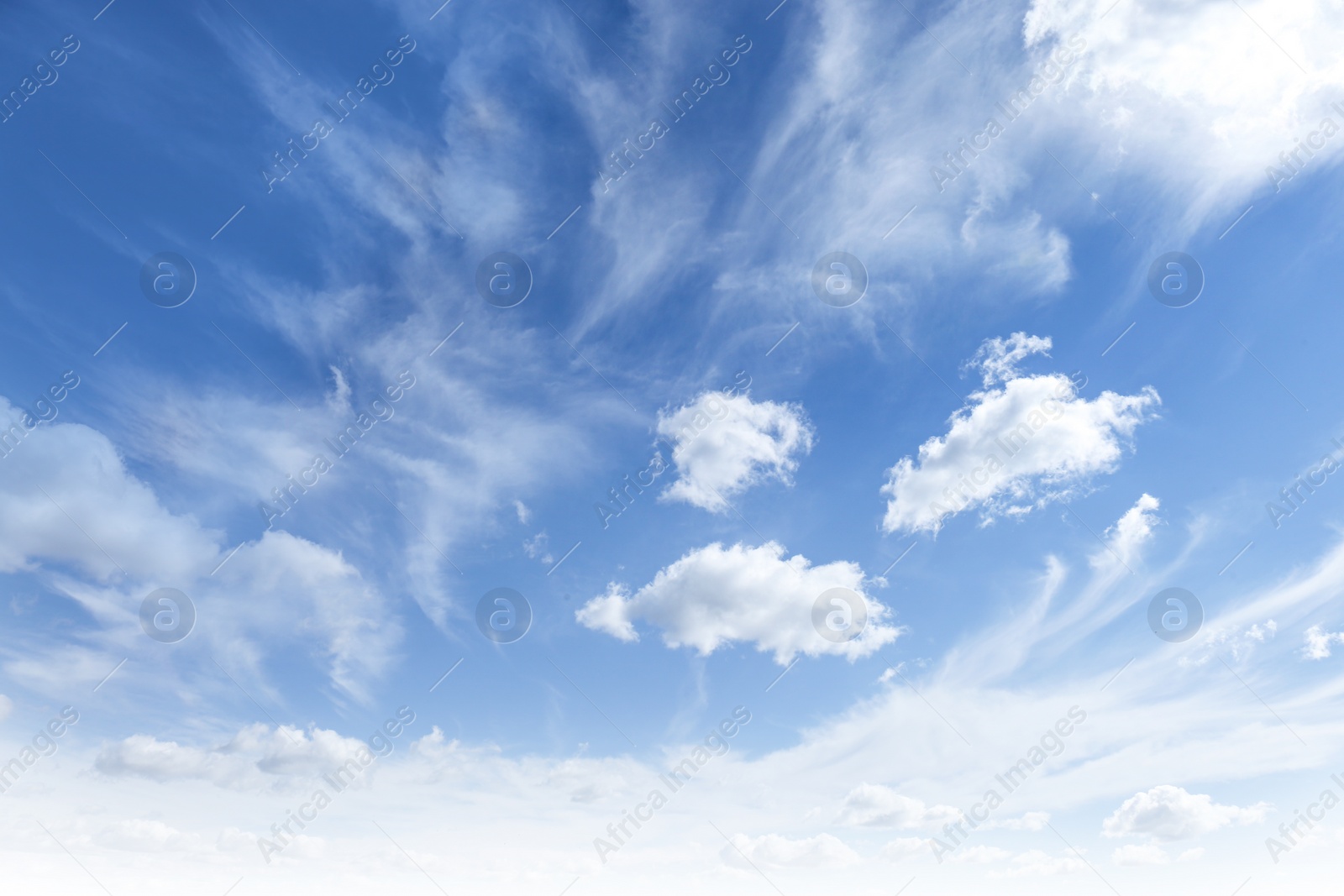 Photo of Picturesque blue sky with white clouds on sunny day